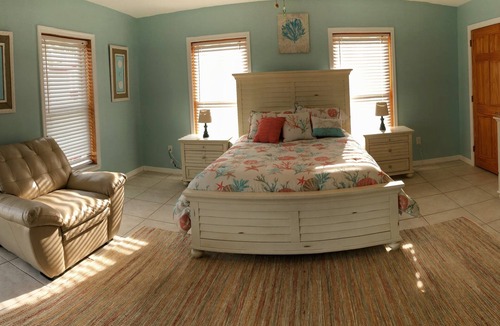 Breezeswept Beach Estates House | Water Front Home. Direct deep water access with private pool/spa/dock & Elevator