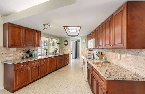 Venetian Way House | Water's Edge Retreat: 3B/2B Canal Front Home with Private Dock