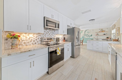 Convair Cove House | Waterfront Home with Pool | Walk to Beach | Family & Dog Friendly | Launch Views