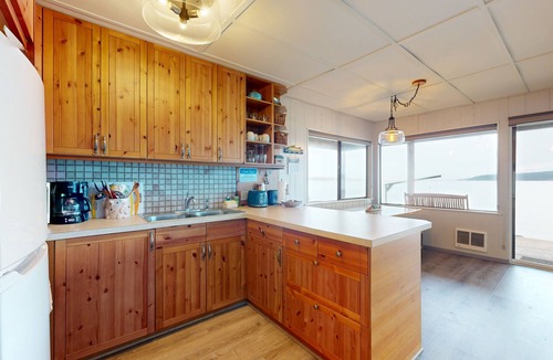 Langley House | Waterfront home with views, deck and open concept living