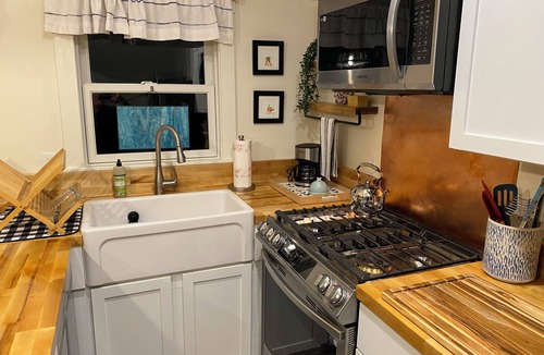 Malletts Bay Cottage | Welcome to 54 West Lake Shore Drive, a charming, single-floor home near the peaceful shores of Lake Champlain. This 1,200-square-foot residence offers 2 bedrooms (1 King, 1 Queen), 1.5 bathrooms with a shower and soaker tub. The thoughtfully designed