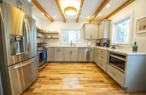 Jericho House | Woodlands: Luxury Vermont log cabin with sweeping views of field and forest.