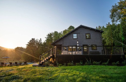 Jericho House | Woodlands: Luxury Vermont log cabin with sweeping views of field and forest.
