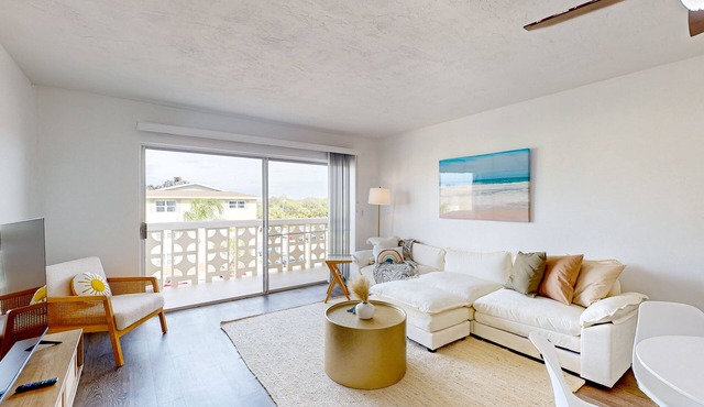 Serene Space Coast condo with balcony, outdoor pool, central AC, & sauna
