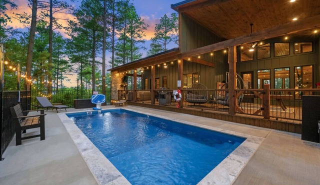 Sleeps 18 people with a private heated pool, hot tub, playground, fire pit, and a private arcade!