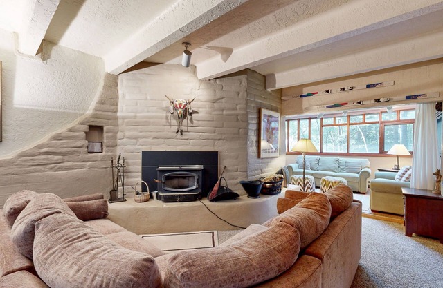 Designer Forest-View Condo with Balcony, Wood Stove & Sunroom - Near Slopes