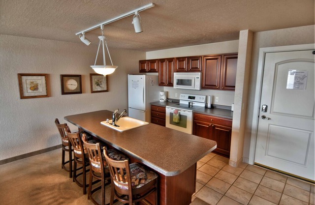 T303 Beautiful condo on Tagalong Golf Course overlooking Red Cedar lake