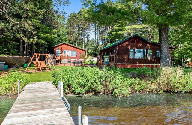 Two cozy, lakefront cottages w/2 docks, a patio, firepit, 2 gas grills, & WIFI