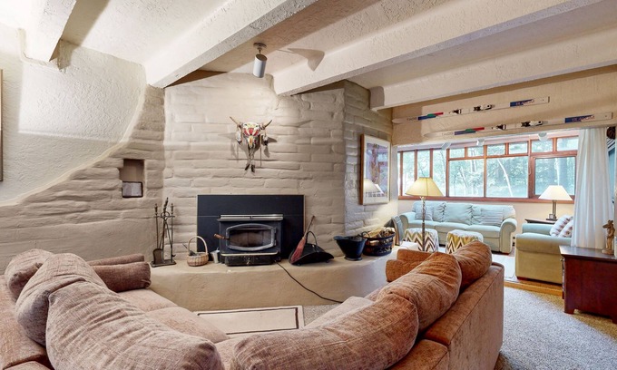 Taos Ski Valley Condo | Designer Forest-View Condo with Balcony, Wood Stove & Sunroom - Near Slopes