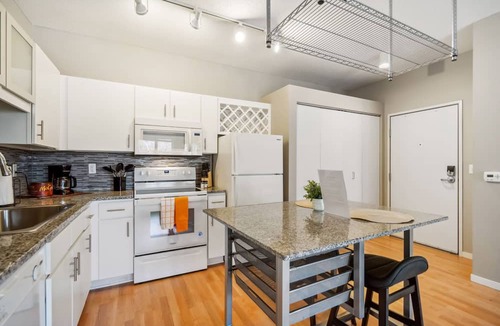 Mill District Apartment | CozySuites Mill District with pool, gym #01